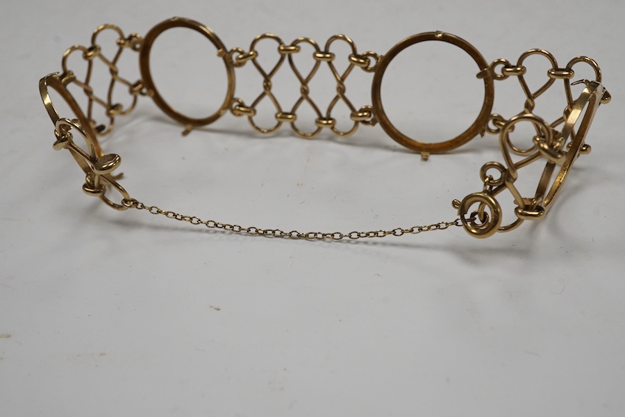 A 9ct gold coin bracelet (now lacking coins), one other 9ct gold coin mount and a similar yellow metal mount, gross weight 13.4 grams. Condition - poor to fair